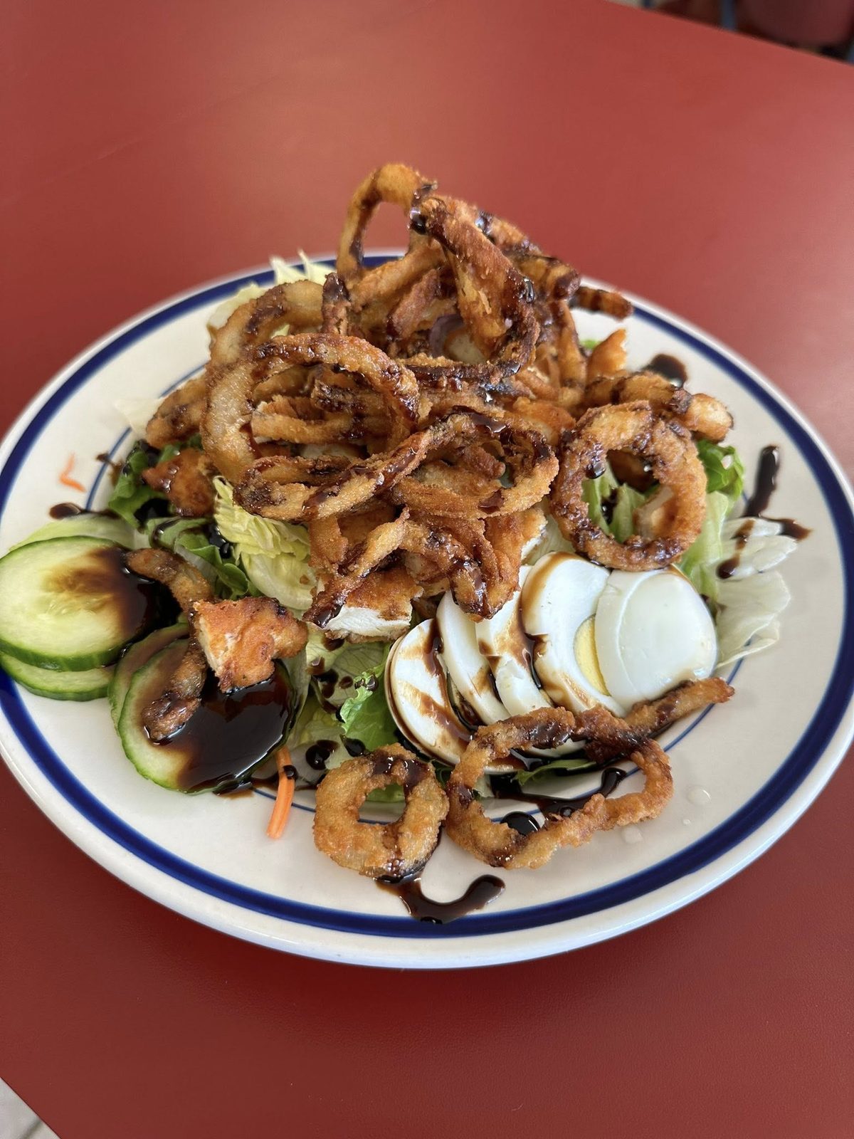 Chicken salad with crispy onions and balsamic glaze