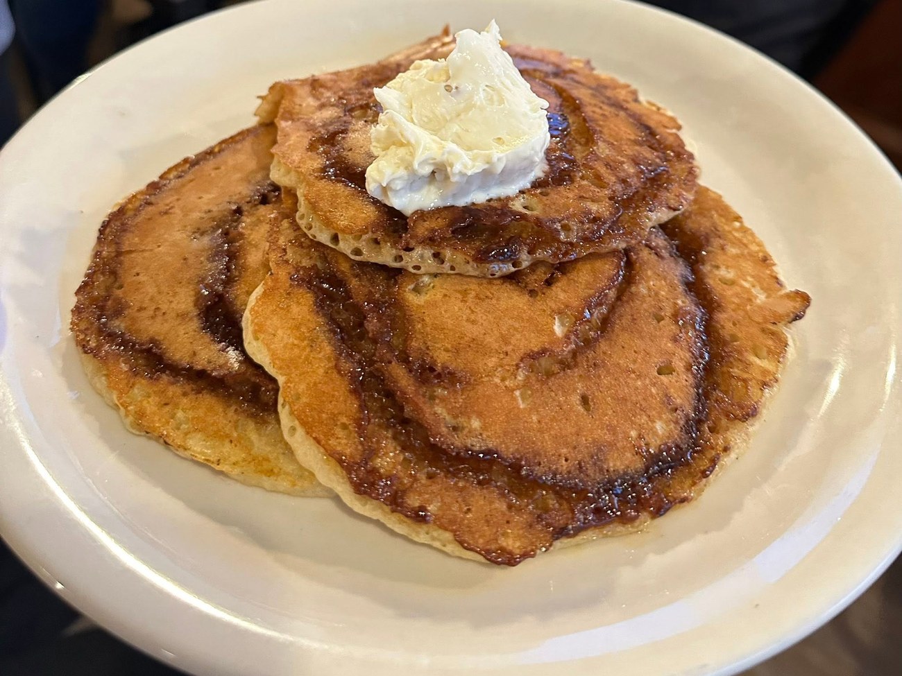 Cinnamon swirl pancakes topped with icing