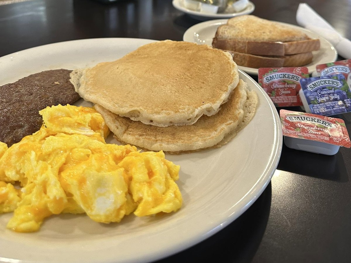 Eggs, sausage, pancakes and toast