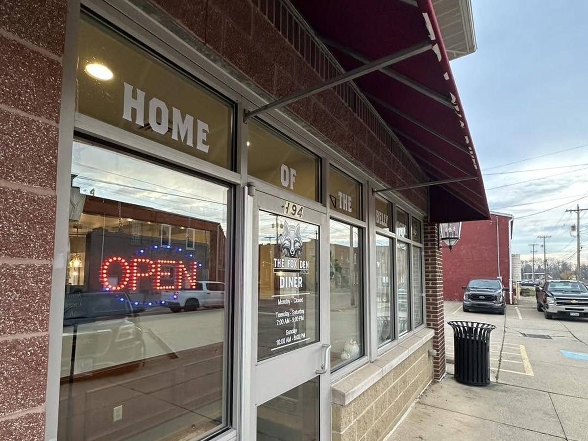 The Fox Den storefront in Wellington, Ohio with Home of the Belly Buster lettering across the windows
