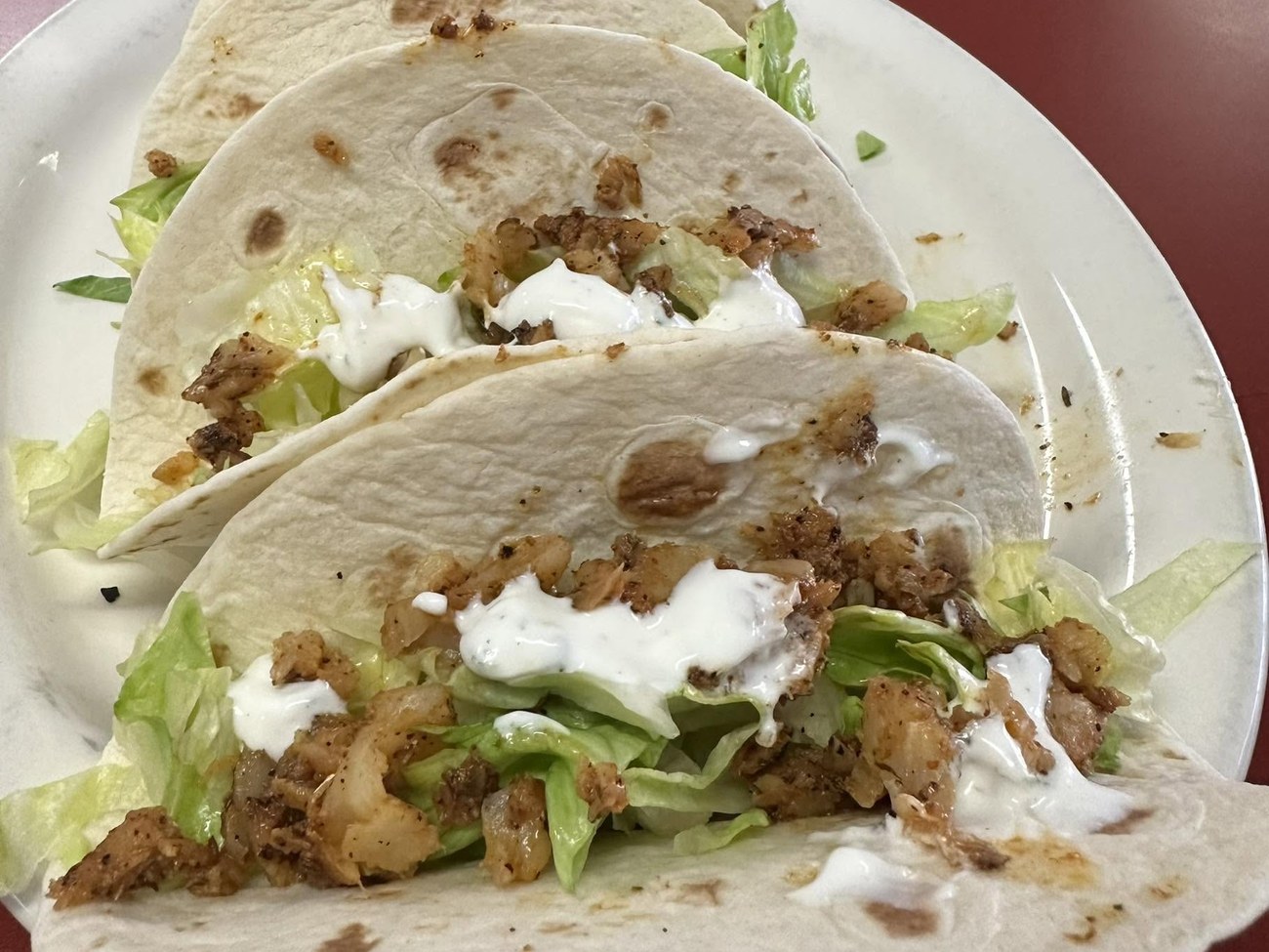 Soft fish tacos with lettuce and ranch