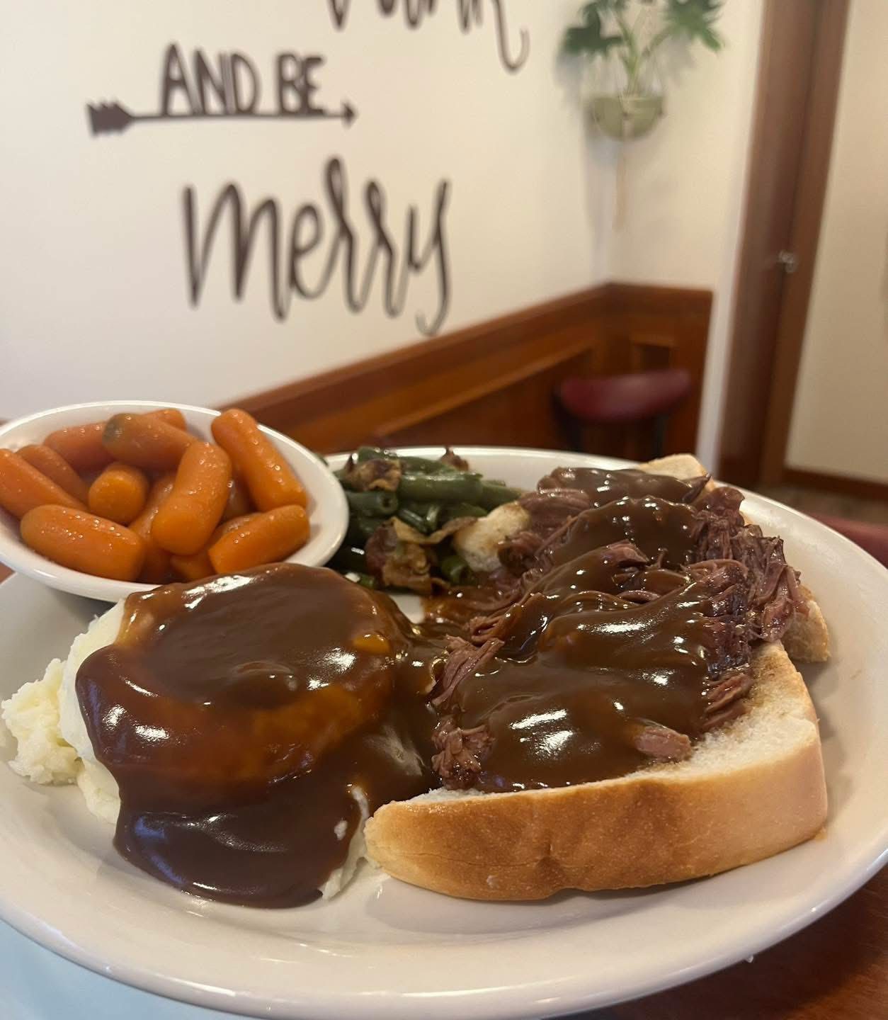 Open-faced roast beef with gravy and mashed potatoes