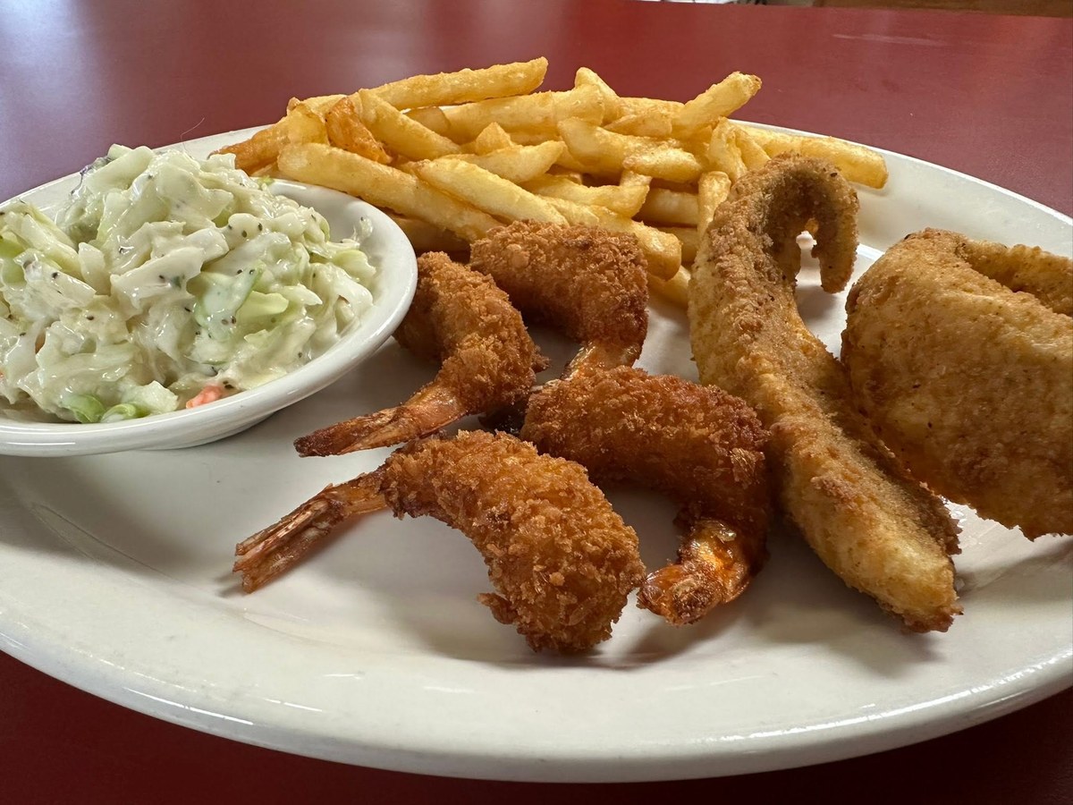 Fried perch and breaded shrimp with fries and coleslaw