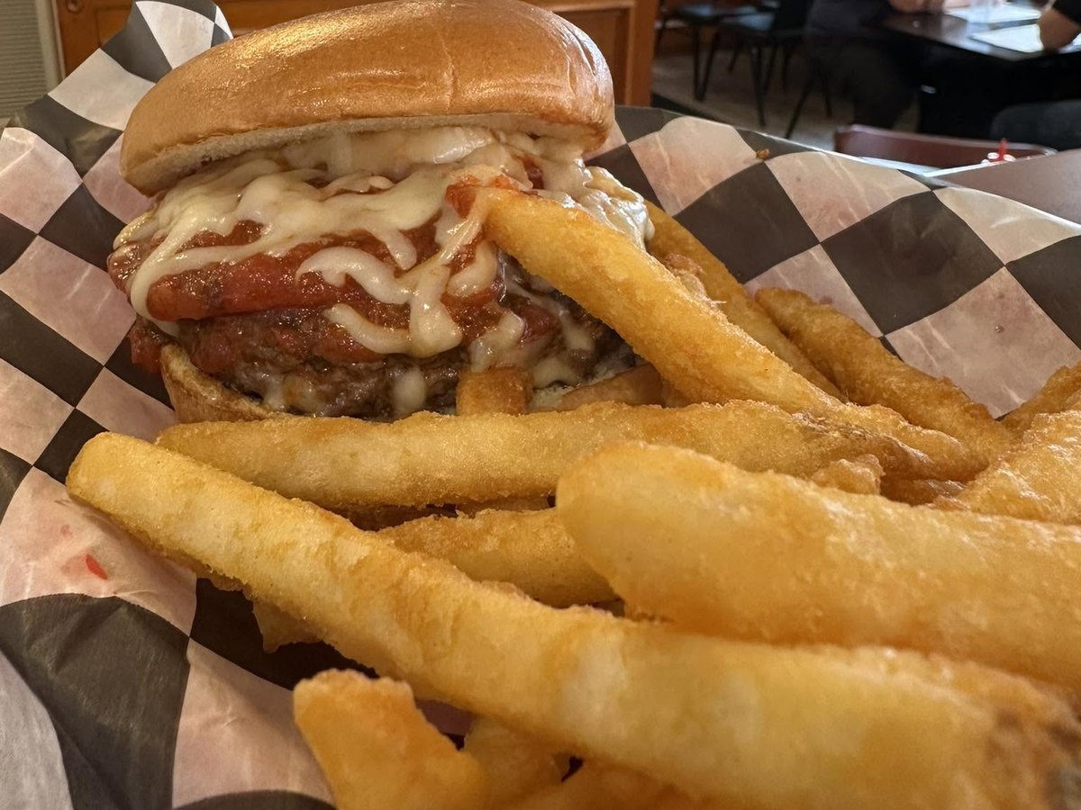 Pizza burger with marinara and melted cheese, with fries