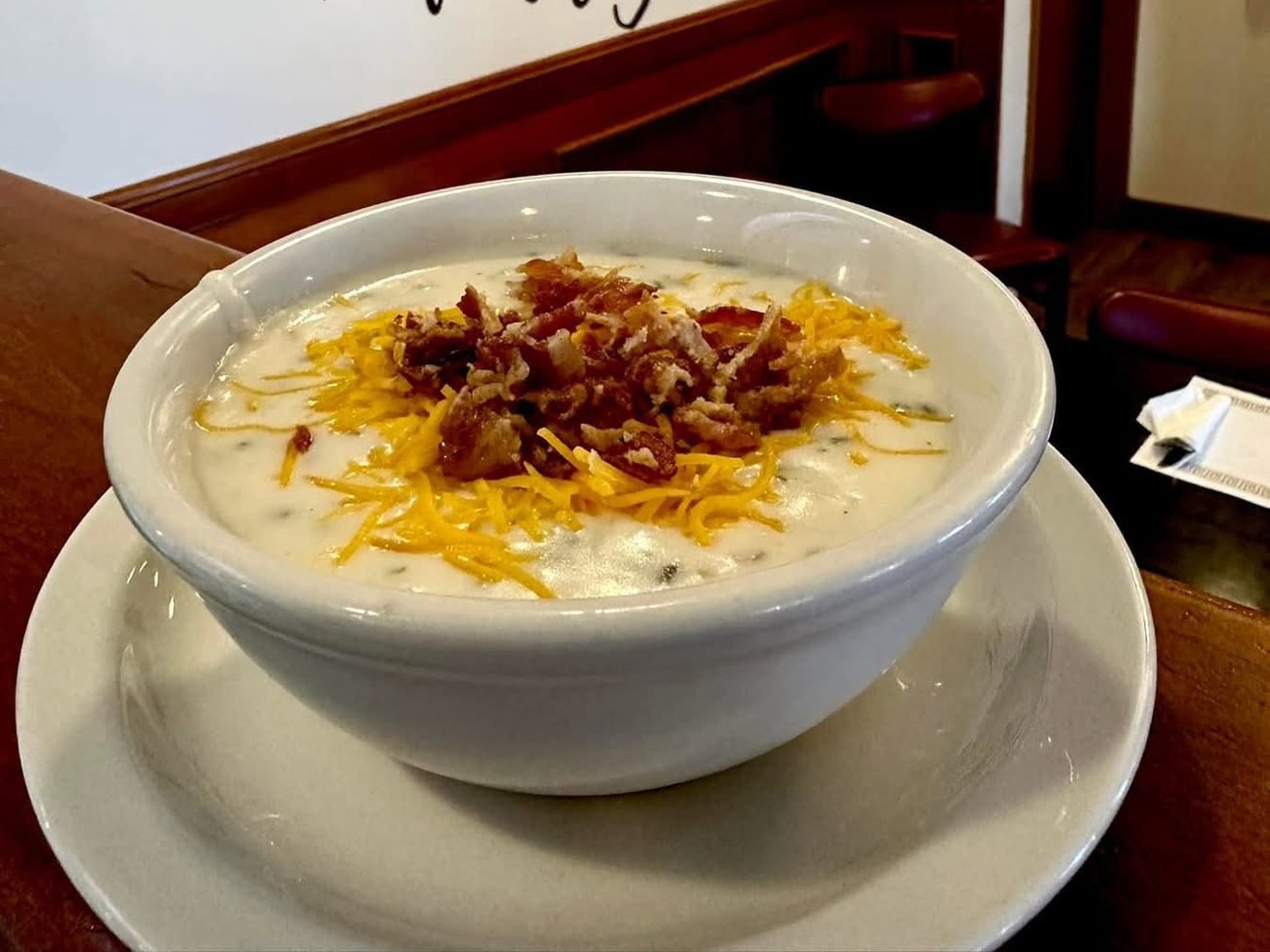 Loaded potato soup topped with cheddar and bacon