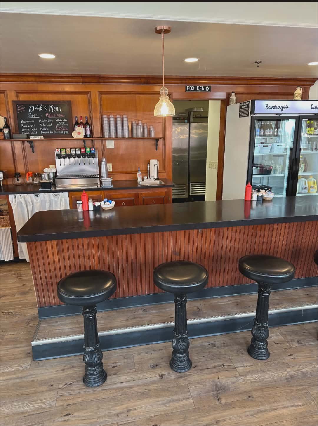 Drink counter with soda fountain and drinks menu board