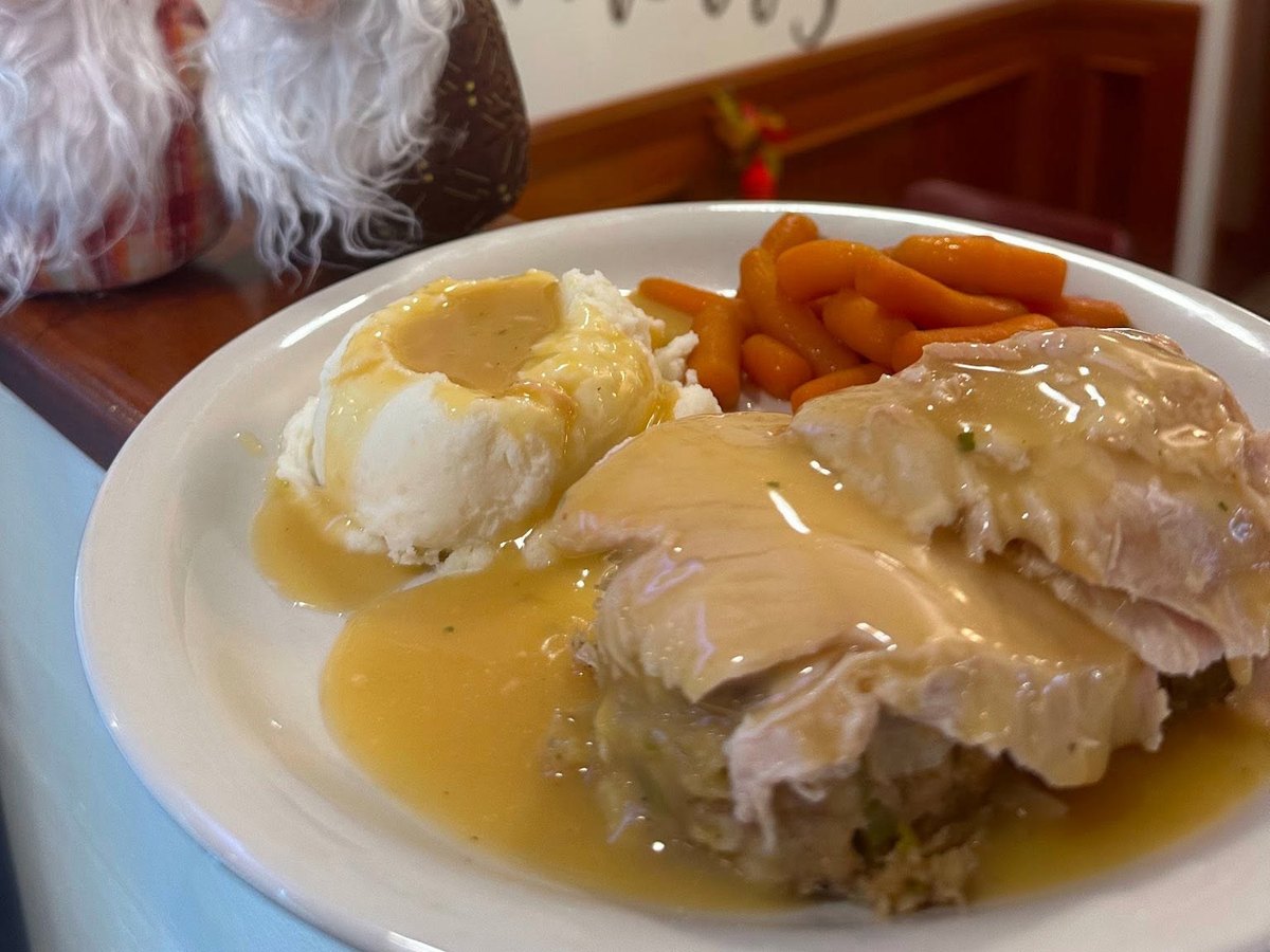 Sliced turkey with stuffing, mashed potatoes and carrots