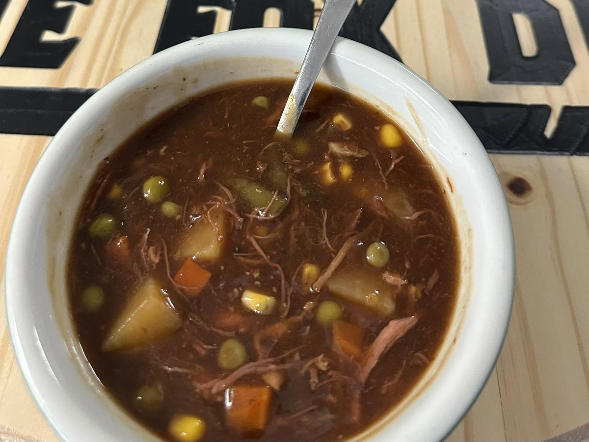 Vegetable beef soup with potatoes, carrots, peas and corn
